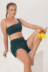 naturally dyeing sustainable and ethically handmade yoga wear Sunbe Design short legging in dark green color